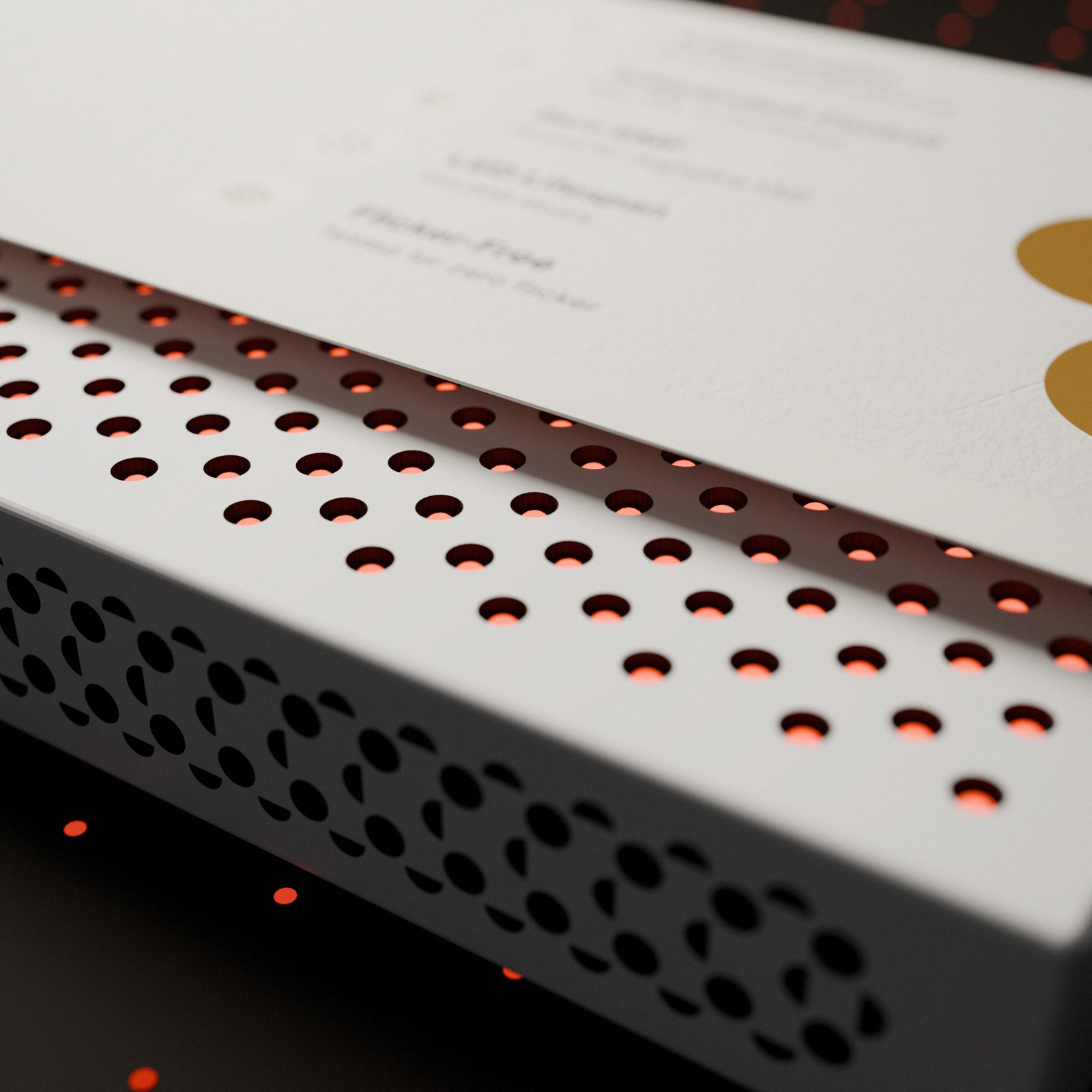 Close-up of the perforated pattern with the LEDs glowing behind